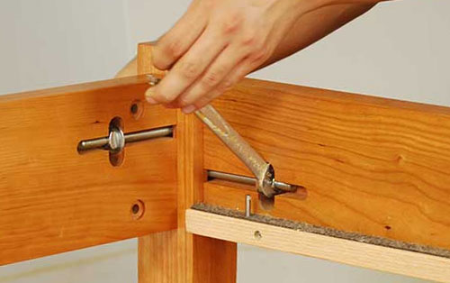 Tighten side rail bolts